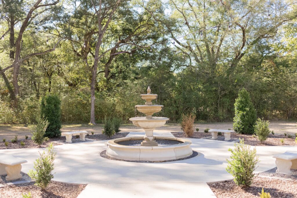 Fountain surrounded by trees makes an outdoor setting for weddings