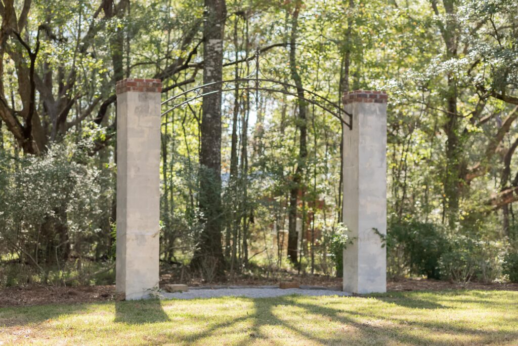 Columns with wrought iron arch at Oak Hill Estate